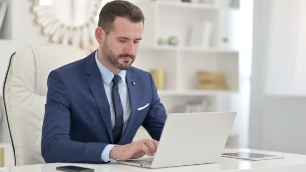 Sick Businessman with Laptop Coughing in Office — Stock Video