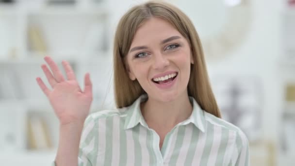 Portrait of Cheerful Young Woman Waving at the Camera — Stock Video © ramerocrist.gmail #393447364