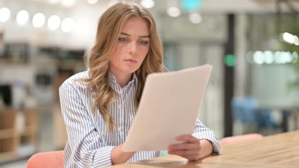 Disappointed Businesswoman Reading Documents in Office — Stock Video