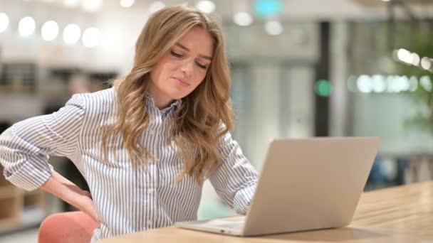 Tired Businesswoman with Laptop having Back Pain in Office — Stock Video