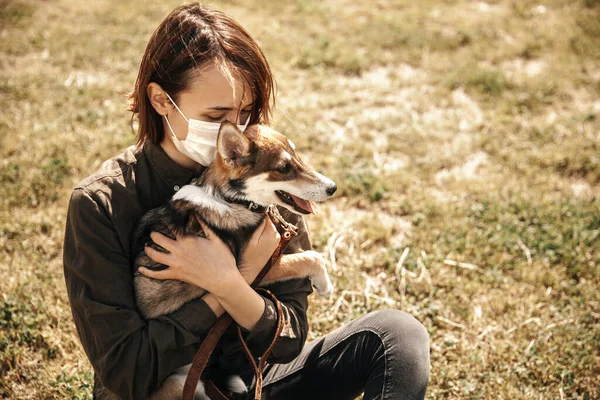 Girl hugs a dog. Dog in the arms of a girl.