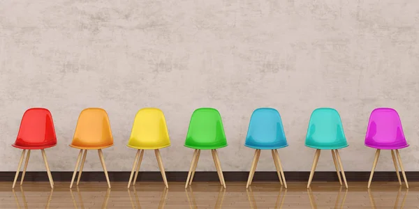 Chairs in modern design arranged in front of the gradient grey w — Stock Photo, Image