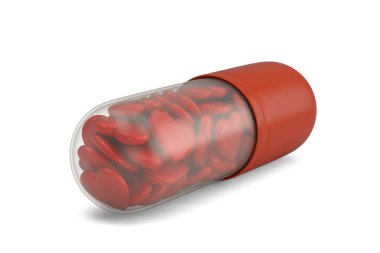 Büyük bir hap ve beyaz backgroun izole kapsül içinde kalpler