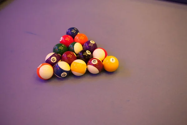 Colorful billiards balls. Billiard ball at blue table. Colorful American pool snooker balls background. American Billiard in bar. Close up Billiard balls. Bar game. Billiard table game.