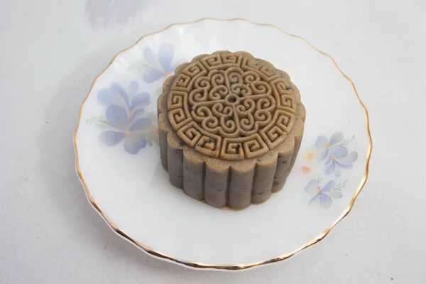 Vietnamese mid autumn festival cake. Mooncakes are traditional pastries eaten during the Mid-Autumn Festival. The festival involves family getting together to share mooncakes while watching the moon