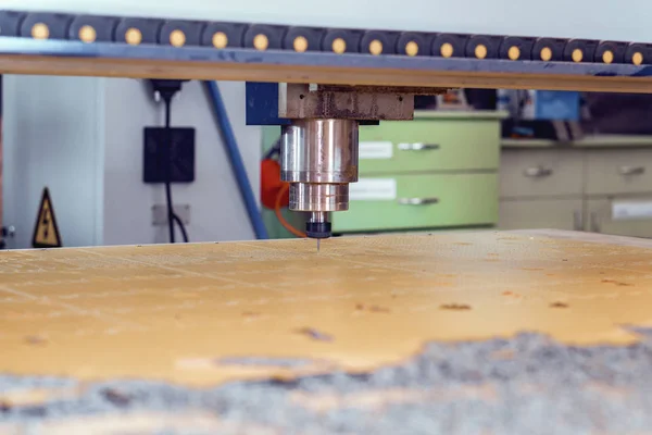 Turning and milling machines with CNC. Spindle and cutter above the working surface.