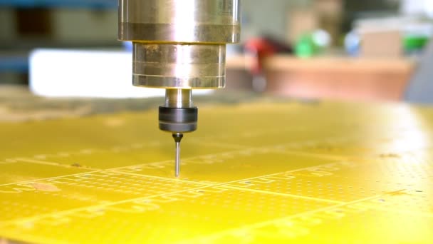 Close-up process of drilling holes in a plastic part on a CNC machine. — Stock Video