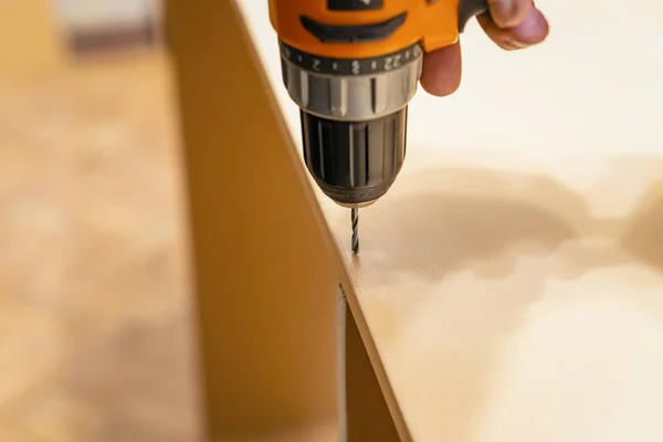 Home assembly furniture. Drilling holes for screws. — Stock Photo, Image