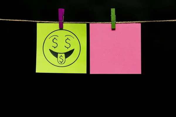 Copy space. Two stickers. On the yellow of a smiley face an expression of a sense of wealth. — Stock Photo, Image