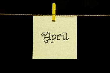 Uzay kopyalayın. Yılın ayı. Beyaz etiket. Sayfa kitabe Nisan. Sayfa mandal iple bağlı olduğu.