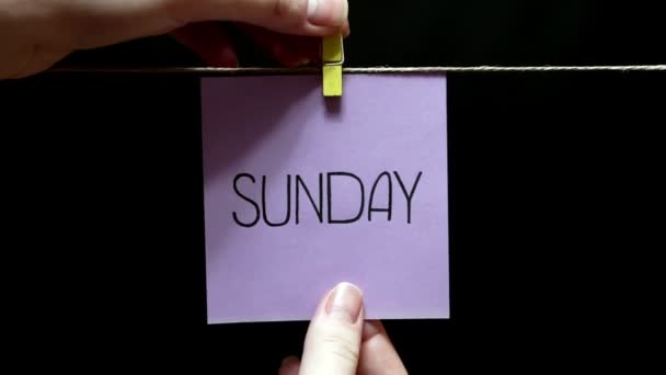 Copy space. Sticker with the inscription sunday. Replacement. Page with the word monday. — Stockvideo
