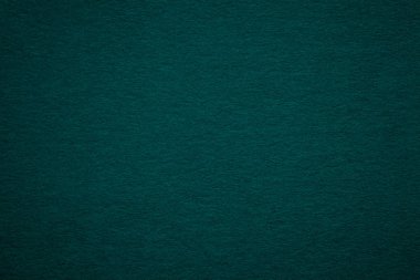 Eski koyu yeşil Kağıt arka plan, closeup doku. Yoğun derin mavimsi kraft karton yapısını. Degrade zemin closeup hissettim.