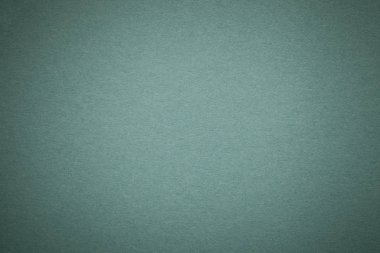 Eski koyu yeşil Kağıt arka plan, closeup doku. Yoğun ışık çelik kraft karton yapısını. Degrade zemin closeup hissettim.