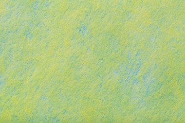Açık yeşil arka planı inşaatı ile keçe kumaş, closeup mavi lekeler. Yün, ipek mat sarı Tekstil doku. Kumaş zemin.
