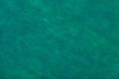 Koyu yeşil turkuaz renkli inşaatı ile keçe kumaş, closeup Lacivert noktalar. Yün, ipek mat Tekstil doku. Kumaş zemin.