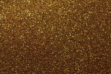 Koyu altın parlak arka plan küçük payetler, portre. Tekstil gelen parlak parlak zemin. Pırıltılı bronz kağıt