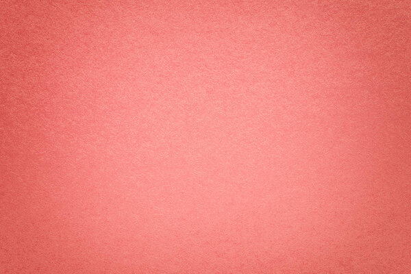 Texture of vintage dark pink paper background with vignette. Structure of dense light rose kraft cardboard with frame. Felt gradient backdrop closeup.