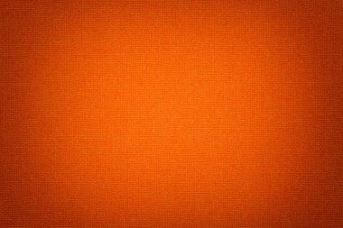 Hasır desen, closeup ile bir tekstil malzemesinden koyu turuncu arka plan. Parlak kırmızı kumaş dokulu yapısını. Kumaş zemin skeç ile.