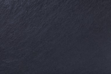 Koyu gri arka plan Doğal kayrak. Doku siyah taş yakın çekim. Grafit zemin makro