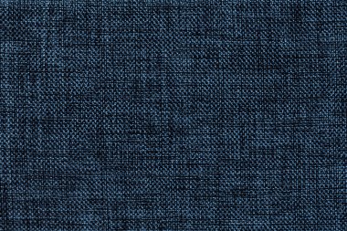 Yoğun dokuma kumaş, closeup torbalama Lacivert arka plan. Denim kumaş ile doğal doku yapısı. Kumaş zemin.