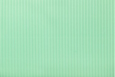 Doku oluklu ışık yeşil kağıt, makro. Nane karton arka plan, closeup çizgili desen.