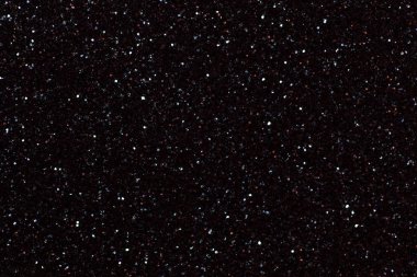 Koyu siyah parlak arka plan küçük payetler, portre. Tekstil gelen parlak parlak zemin. Kağıt ışıltı