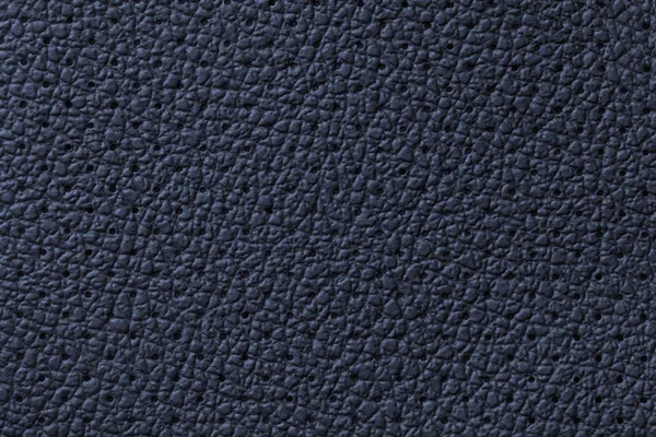 Fond de texture cuir bleu marine perforé, gros plan. Toile de fond en denim de peau ridée . — Photo