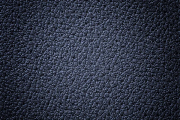 Fond de texture cuir bleu marine perforé, gros plan. Toile de fond en denim de peau ridée . — Photo