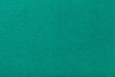 Koyu turkuaz mat süet kumaş çekim. Keçe kadife dokusu.