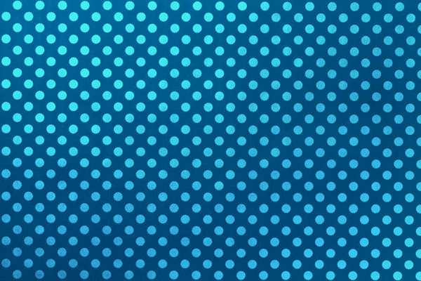 Navy blue background from wrapping paper with a pattern of turquoise polka dot closeup. — Stock Photo, Image