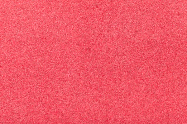Primeros planos de tela de gamuza mate de color rojo claro. Textura de terciopelo de fieltro . — Foto de Stock