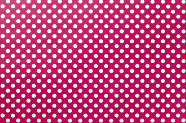 Altın polka nokta dolap bir desen ile ambalaj kağıdı koyu kırmızı arka plan.