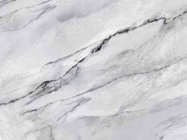 Doğal desenli beyaz mermer dokusu. Gri taş arka plan.