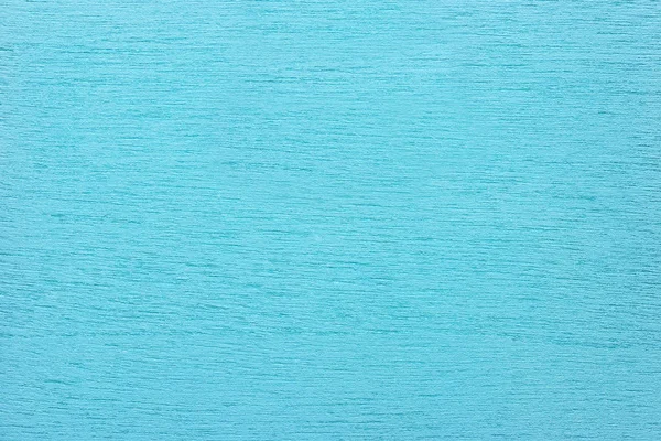 Texture of light blue clean woody background, closeup.