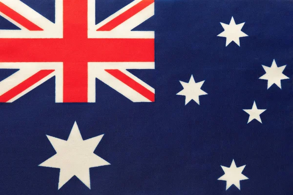 Australie drapeau national de tissu, fond textile. Symbole du monde international pays . — Photo