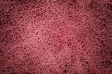 Bir yumuşak döşemelik Tekstil malzemesinden closeup koyu kırmızı arka plan.