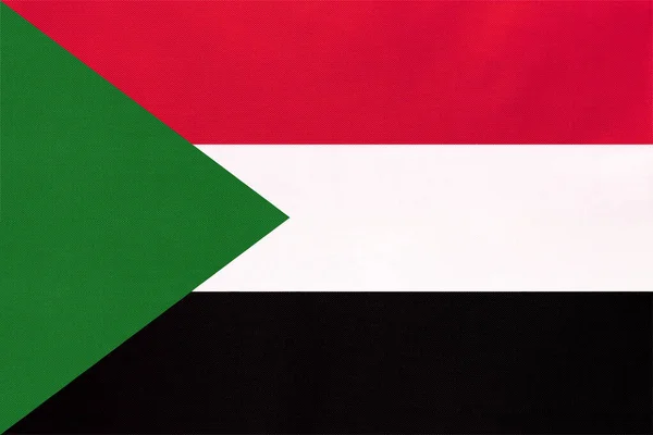スーダン共和国の国旗、織物の背景。世界の象徴アフリカの国. — ストック写真
