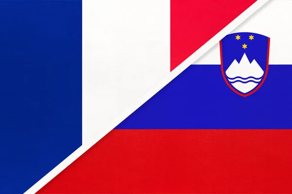 French Republic or France and Slovenia, symbol of national flags from textile. Relationship, partnership and championship between two european countries.