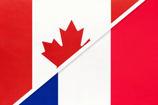 加拿大和法国或法兰西共和国 象征着两个来自纺织品的国旗 欧洲和美洲国家间的关系 伙伴关系和锦标赛 — 图库照片
