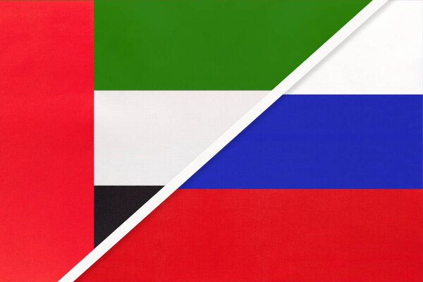 United Arab Emirates or UAE and Russia or Russian Federation, symbol of two national flags from textile. Relationship, partnership and championship between European and Asian countries.