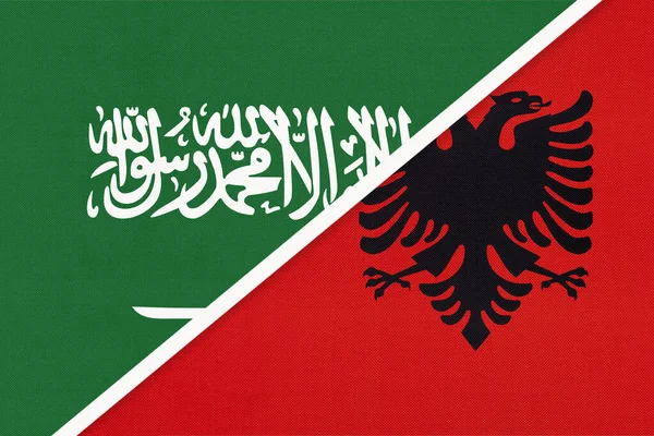 Saudi Arabia and Albania, symbol of two national flags from textile. Relationship, partnership and championship between Asian and European countries.