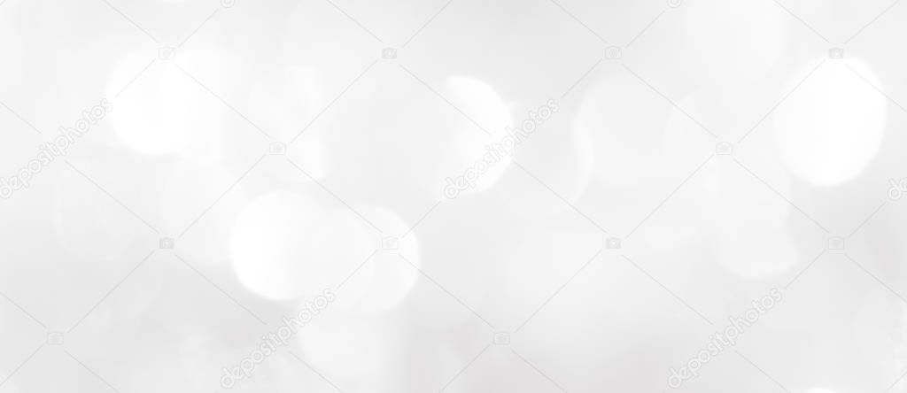 A brilliant blurry white background for a festive mood. Template for greeting card for entertainment.