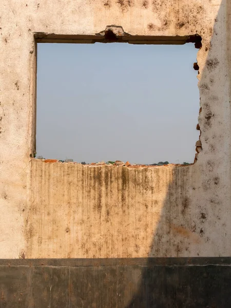 Window of an old abandoned house - view from inside
