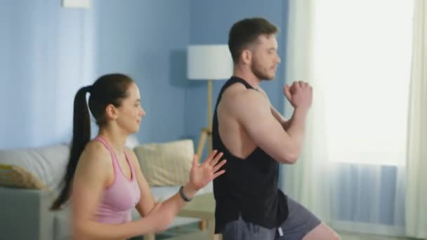 Woman and Man Are Doing Forward Lunges — Stock Video