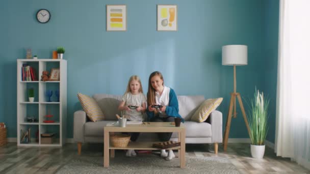 Mom and Daughter Have Fun Playing Video Games — Stock Video