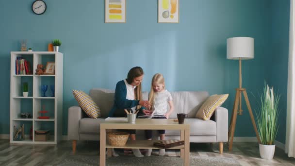 Mom and Daughter Read Book — Stock Video