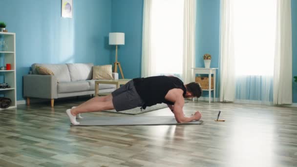 Athletic Man Practices Different Planks — Stock Video