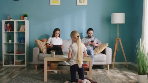 Mom and Dad Spend Time Online Ignoring Their Daughter — Stock Video
