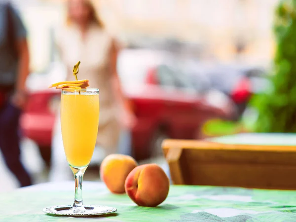 Bellini cocktail atanding on the table at bar\'s terrace outdoor in the downtown