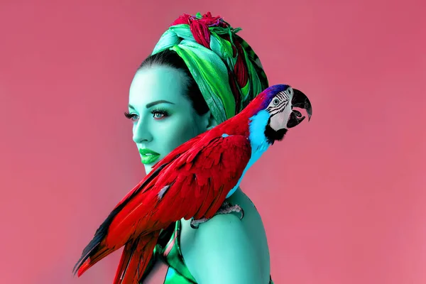 Ultraviolet crazy portrait of young attractive woman in african style holding ara parrot on her hand on bright background — Stock Image Ultraviolet Crazy Portrait Young Attractive Woman African Style Holding Ara Stock Picture